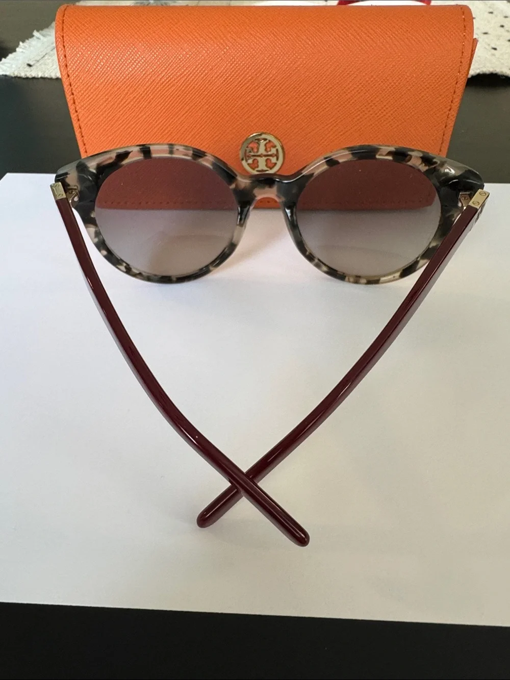 Tory Burch sunglasses.
